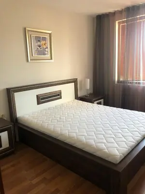 a bedroom with a large bed in a room at Dunav Apt.4 in Ravda