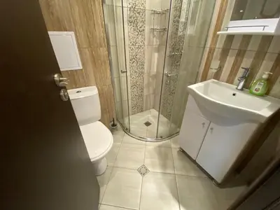 a bathroom with a shower and a toilet and a sink at PARADISO 'В' 107 Private Cozy Studio NESSEBAR in Nesebar