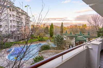 an apartment balcony with a view of a river at СПА Апартаменти за ГОСТИ Затворен комплекс ЕМЕРАЛД in Ravda