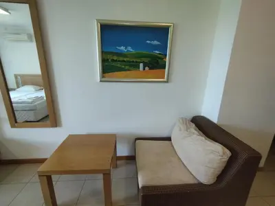 a room with a couch and a table and a mirror at СПА Апартаменти за ГОСТИ Затворен комплекс ЕМЕРАЛД in Ravda