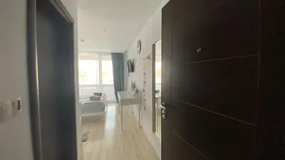 a hallway with a door open to a living room at PARADISO 'B' 108 Private Cozy Room NESSEBAR in Nesebar