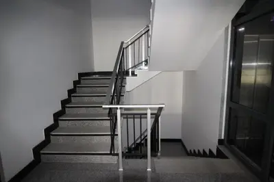 a staircase in an empty building with a railing at PARADISO 'B' 108 Private Cozy Room NESSEBAR in Nesebar