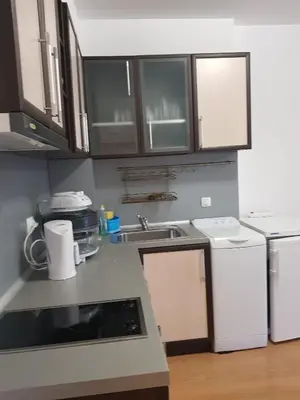 a kitchen with white cabinets and a sink at Excelsior Holiday Apartments 91 Sunny Beach Bulgarien Sonnenstrand in Sunny Beach