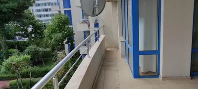 a hallway of a building with a blue door and stairs at Excelsior Holiday Apartments 91 Sunny Beach Bulgarien Sonnenstrand in Sunny Beach