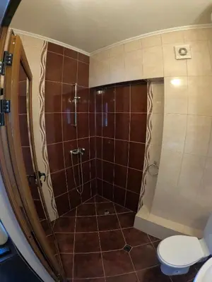 a bathroom with a shower and a toilet at Sunset Yavorov Pomorie in Pomorie