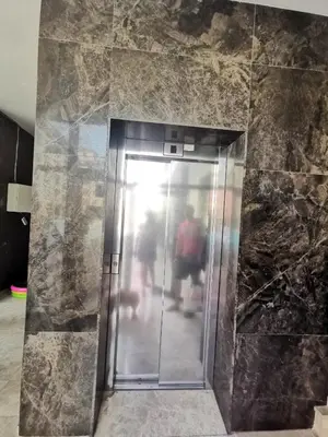an elevator in a building with people walking through it at Lovely Apartments Amadeus Lux in Sunny Beach