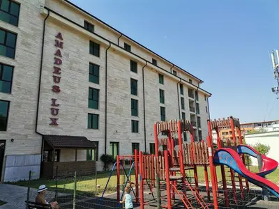 a playground in front of a hotel at Lovely Apartments Amadeus Lux in Sunny Beach