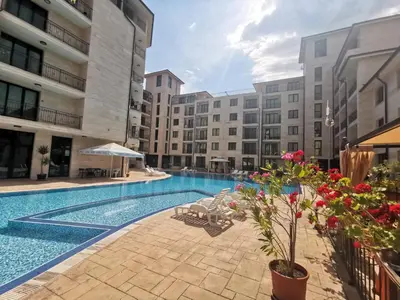 a swimming pool in the middle of a building at Lovely Apartments Amadeus Lux in Sunny Beach