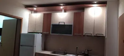 a kitchen with a mirror and a sink and a refrigerator at Apartment Jasna Hotel Oazis in Ravda