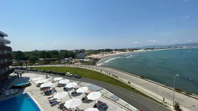 a view of a beach with umbrellas and the ocean at PARADISO B 210 Private Sea View Studio NESSEBAR in Nesebar