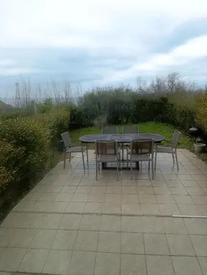 a table and chairs sitting on a patio at Family Hotel Lalov Egrek in Lozenets