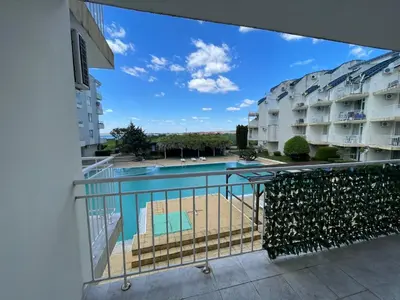 a view of the pool from the balcony of a apartment at Rutland SP apartments in Ravda