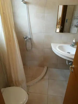 a bathroom with a shower and a toilet and a sink at Fantastic family villa with sea view in Byala