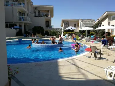 a group of people playing in a swimming pool at Fantastic family villa with sea view in Byala