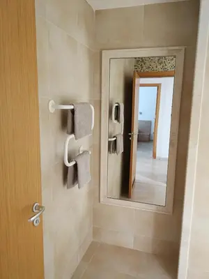 a bathroom with a mirror and a walk in shower at Fantastic family villa with sea view in Byala