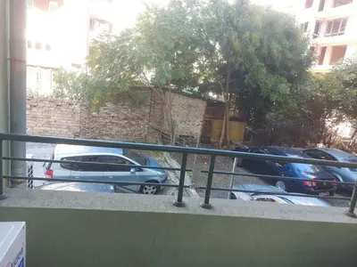 a balcony with cars parked in a parking lot at Studio and 1bedroom apartment Burgas - Economy in Burgas City