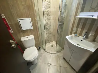 a bathroom with a toilet and a shower and a sink at PARADISO B 209 Private Sea View Studio NESSEBAR in Nesebar