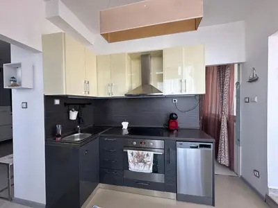 a kitchen with a sink and a stove at Oazis Ravda in Ravda