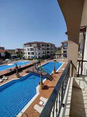 a view of the swimming pool at a resort at BBR26- Sea View First Line Apartment Sarafovo in Burgas City