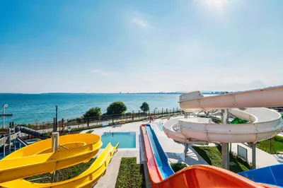 a water park with a bunch of slides and a pool at Voya Beach Resort - Ultra All Inclusive in Sveti Vlas