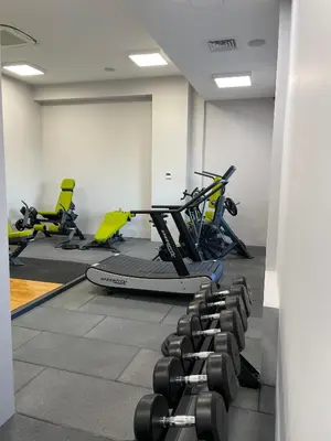 a gym with rows of exercise bikes in a room at City view in Residences in Burgas City