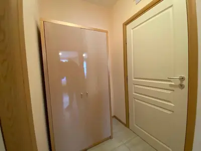 a white door in a room with a tile floor at MESSEMBRIA A309 Studio Sunny Beach in Sunny Beach