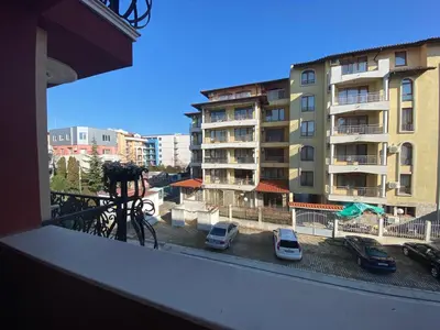 a view from a balcony of a building with parked cars at MESSEMBRIA A309 Studio Sunny Beach in Sunny Beach