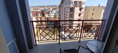 a balcony with a view of a city at Central Plaza - Studio - Sunny Beach in Sunny Beach