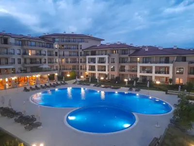 a large swimming pool in front of a building at Sea Dreams Apartment in Sveti Vlas