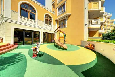 a playground in a building with a slide at Marina Sands Bijou Boutique - Amazing views in Obzor