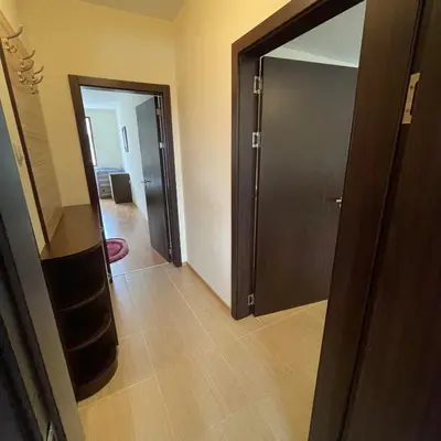 a hallway with a door leading to a room at private apartments in Apolon in Ravda