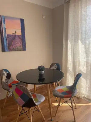 a dining room with a table and chairs at Marea Garden apartments in Ravda