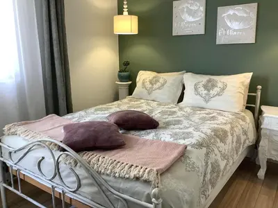 a bed with pillows on it in a bedroom at CASA VISTA in Burgas City