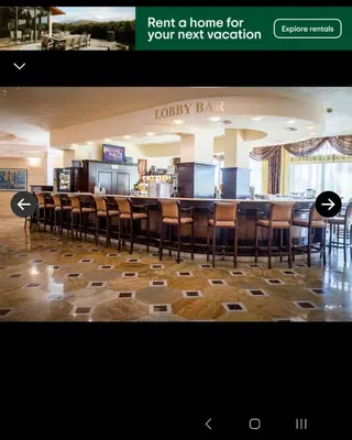 a bar with a bunch of chairs in a restaurant at 