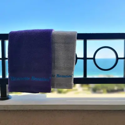 a pair of towels on a window sill at 