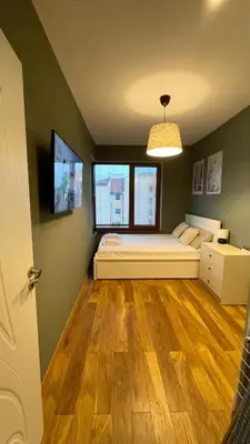 a bedroom with a bed and a window at Dune Apartment Nessebar in Nesebar