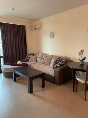 a living room with a couch and a table at Babylon SP apartment 56 in Sunny Beach