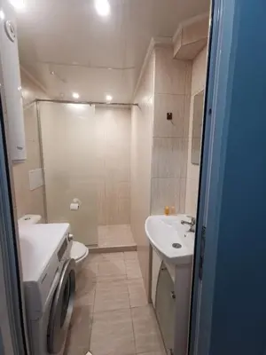 a bathroom with a toilet and a sink at Двустаен апартамент в центъра на гр. Бургас in Burgas City