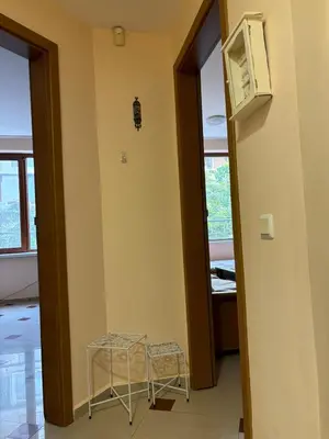 a room with two stools and a television and a door at Студио Бургас 2 in Burgas City
