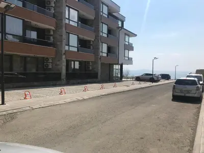 a car parked on a street next to a building at Sunrise Beach A4, Sarafovo in Burgas City