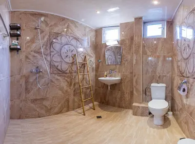 a bathroom with a shower and a toilet and a sink at SeaBed Haven in Varna City