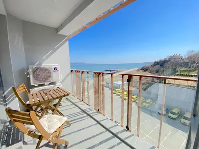 a balcony with a desk and a computer on it at Paradiso Aparthotel - Private apartment -BSR-2 in Nesebar