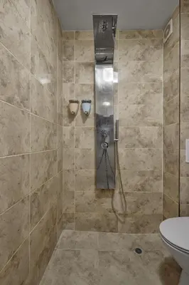 a bathroom with a shower with a toilet and a sink at Top Center, Sea Garden, Brand New Studio - Majestic in Burgas City