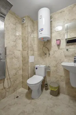 a bathroom with a toilet and a sink at Top Center, Sea Garden, Brand New Studio - Majestic in Burgas City