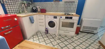 a small kitchen with a washing machine in it at Brand studio in Varna City