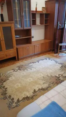 a kitchen with a large rug on the floor at 27 юли 3 бюджет in Varna City