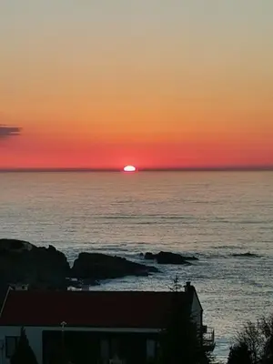 a sunset over the ocean with the sun in the horizon at Sunrise place Eva in Sozopol