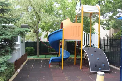 a playground with a blue and orange slide at Apart complex Starfish със собствено паркомясто in Sveti Vlas