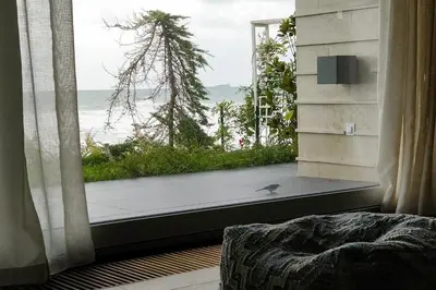 a room with a window with a view of the ocean at Beach Villa Varna - cosiness 4 meters from the sea in Varna City