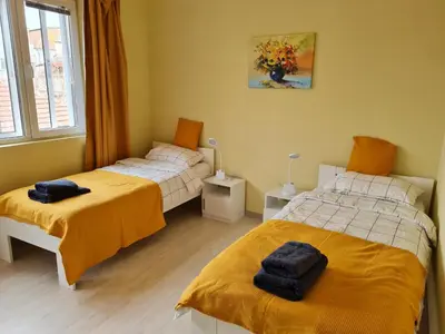 a bedroom with two beds and a window at Spacious apartment 